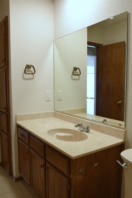 1911 Klattenhoff Drive Austin, TX 78728 - Photo 9 of 14 Bathroom featuring vanity and light tile patterned floors