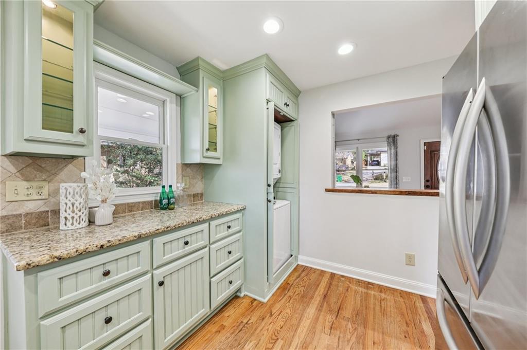 1173 Willivee Drive Decatur, GA 30033 - Photo 17 of 35 a kitchen with granite countertop a refrigerator and a sink