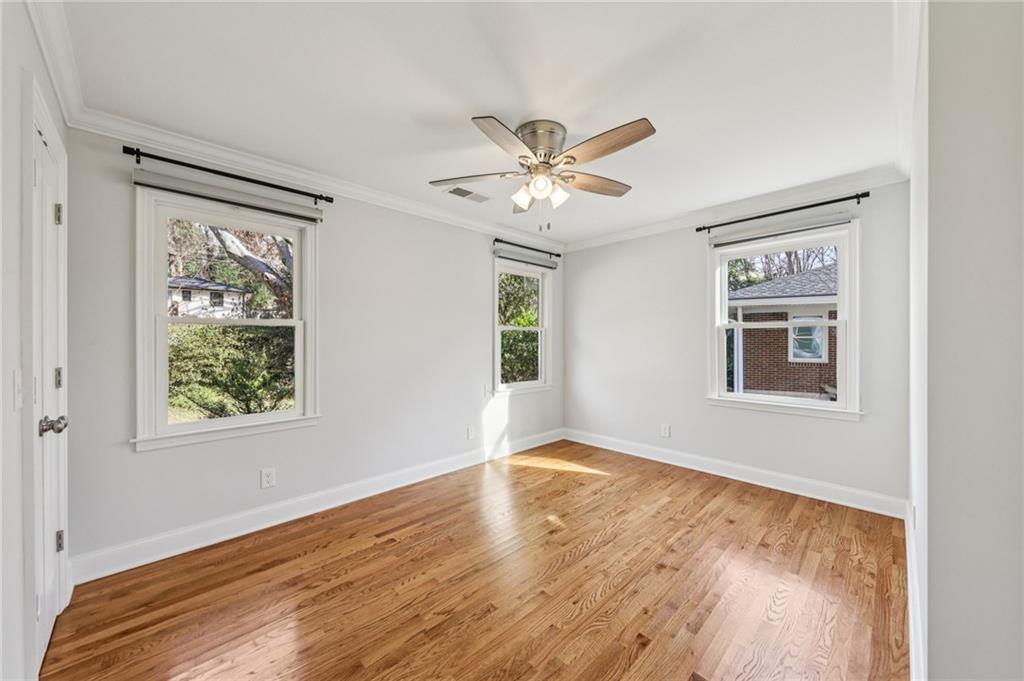 1173 Willivee Drive Decatur, GA 30033 - Photo 21 of 35 a view of an empty room with a window and wooden floor