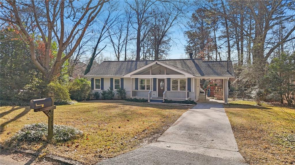1173 Willivee Drive Decatur, GA 30033 - Photo 35 of 35 a front view of house with yard and trees in the background