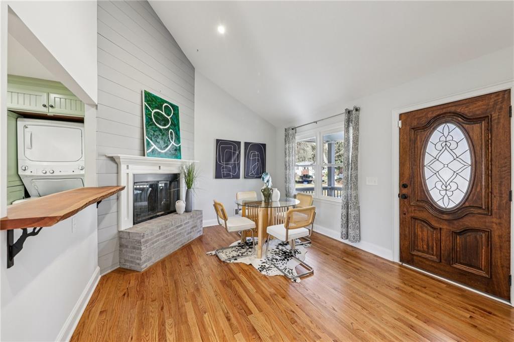 1173 Willivee Drive Decatur, GA 30033 - Photo 6 of 35 a living room with furniture a fireplace and a wall painting
