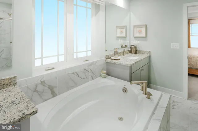 a bath tub sitting in a bathroom next to a window