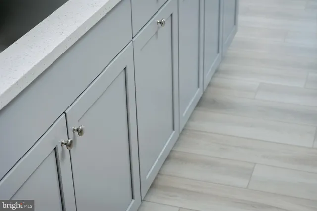 a view of staircase with wooden floor and fan