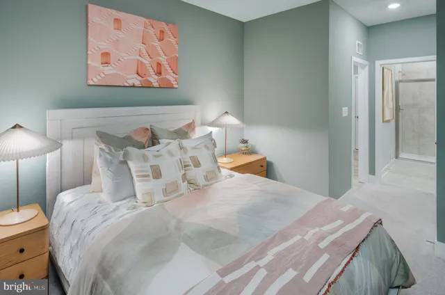 a bedroom with a bed and cupboard