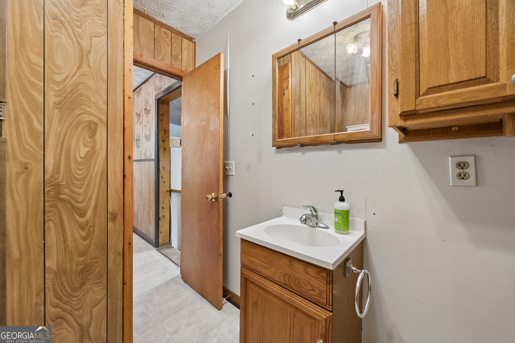 14 Graham Lane St. George, GA 31562 - Photo 16 of 21 a bathroom with a sink and a mirror