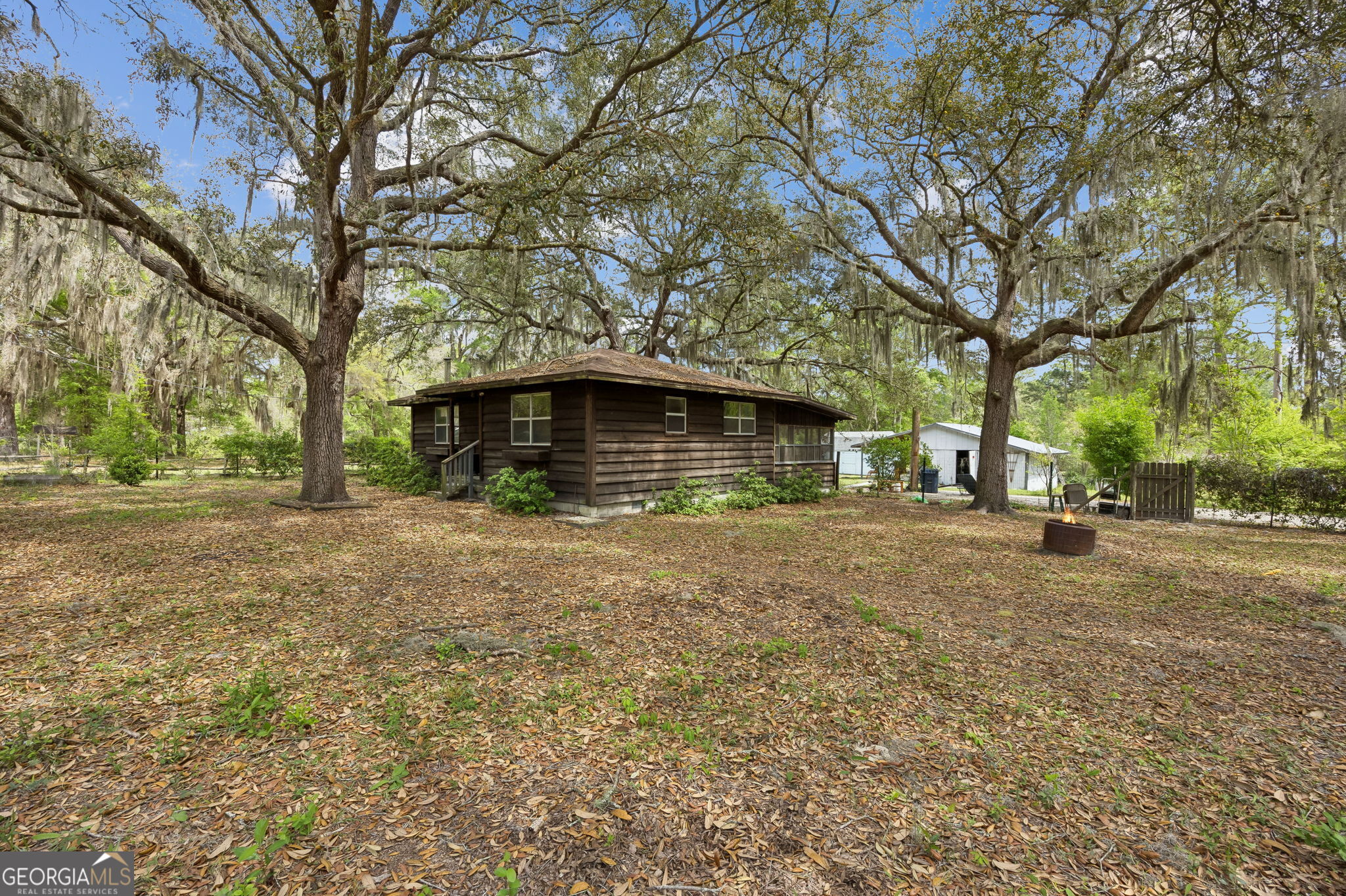 14 Graham Lane St. George, GA 31562 - Photo 4 of 21 a front view of a house with a yard