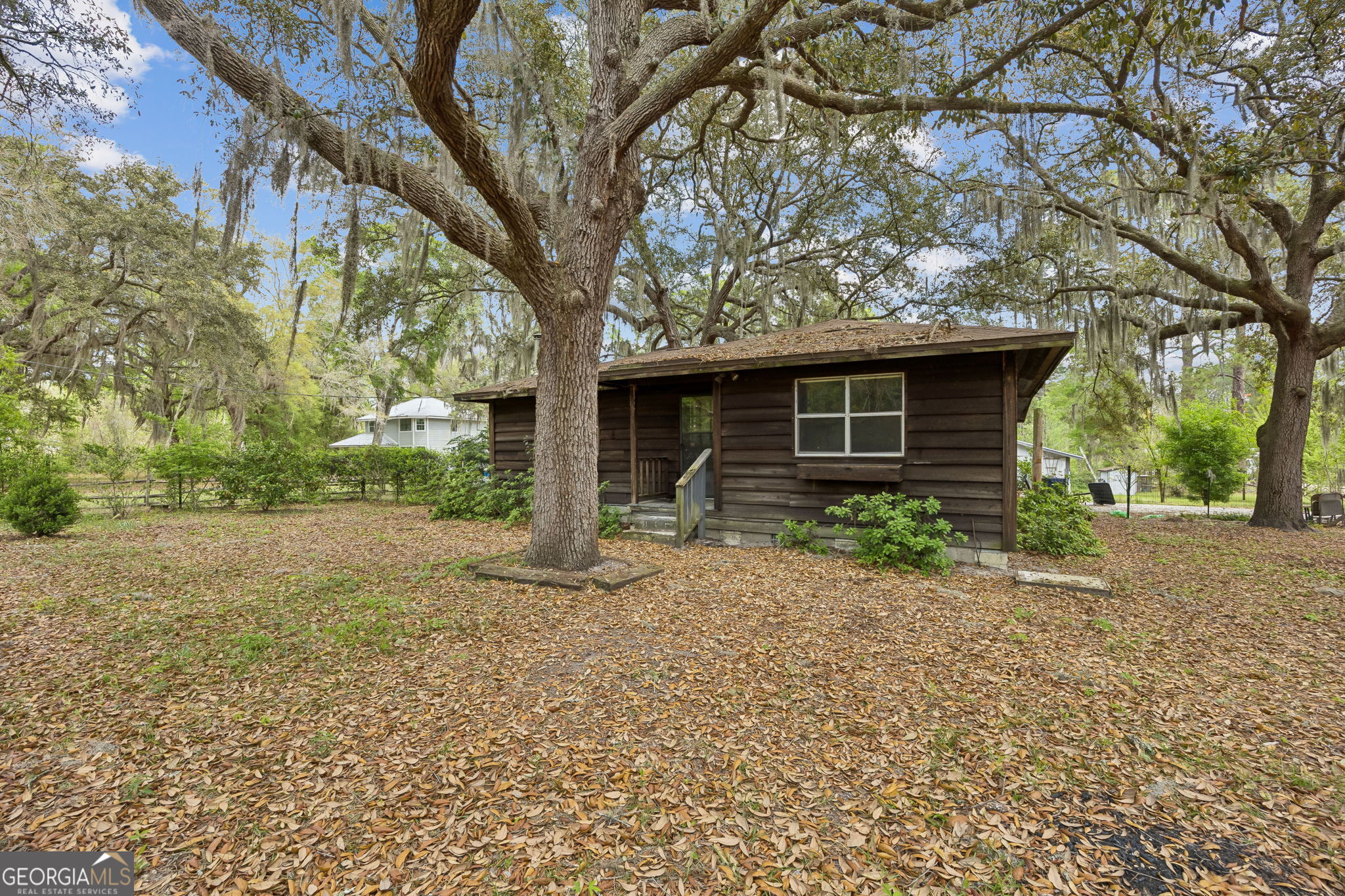 14 Graham Lane St. George, GA 31562 - Photo 5 of 21 a front view of a house with garden