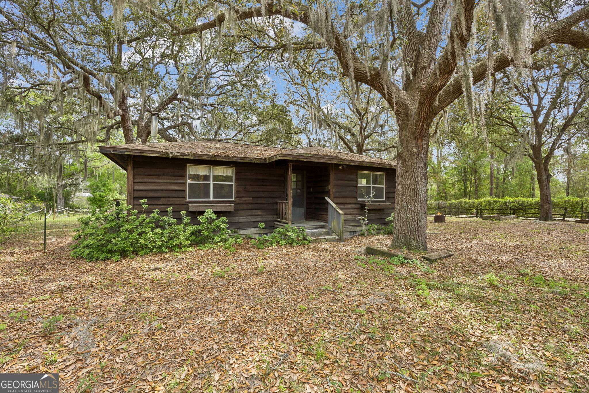 14 Graham Lane St. George, GA 31562 - Photo 6 of 21 a front view of a house with garden
