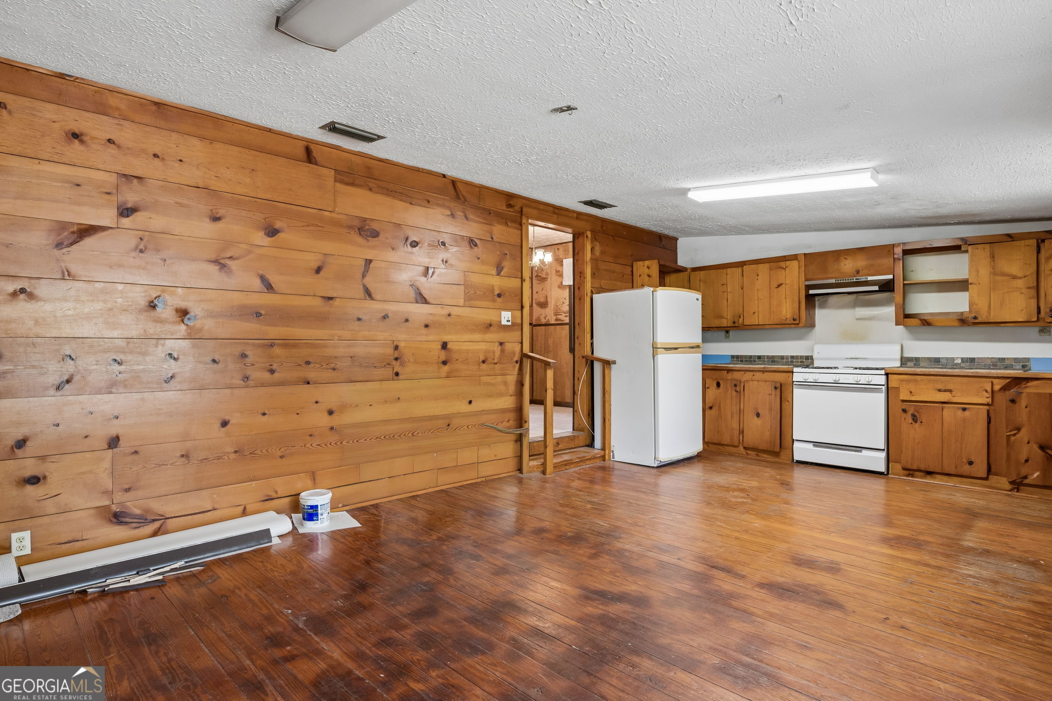 14 Graham Lane St. George, GA 31562 - Photo 10 of 21 a view of kitchen with refrigerator and microwave