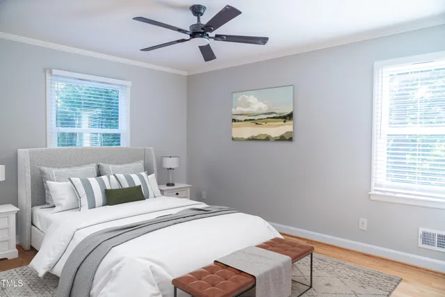 a bathroom with a sink a toilet a mirror and shower