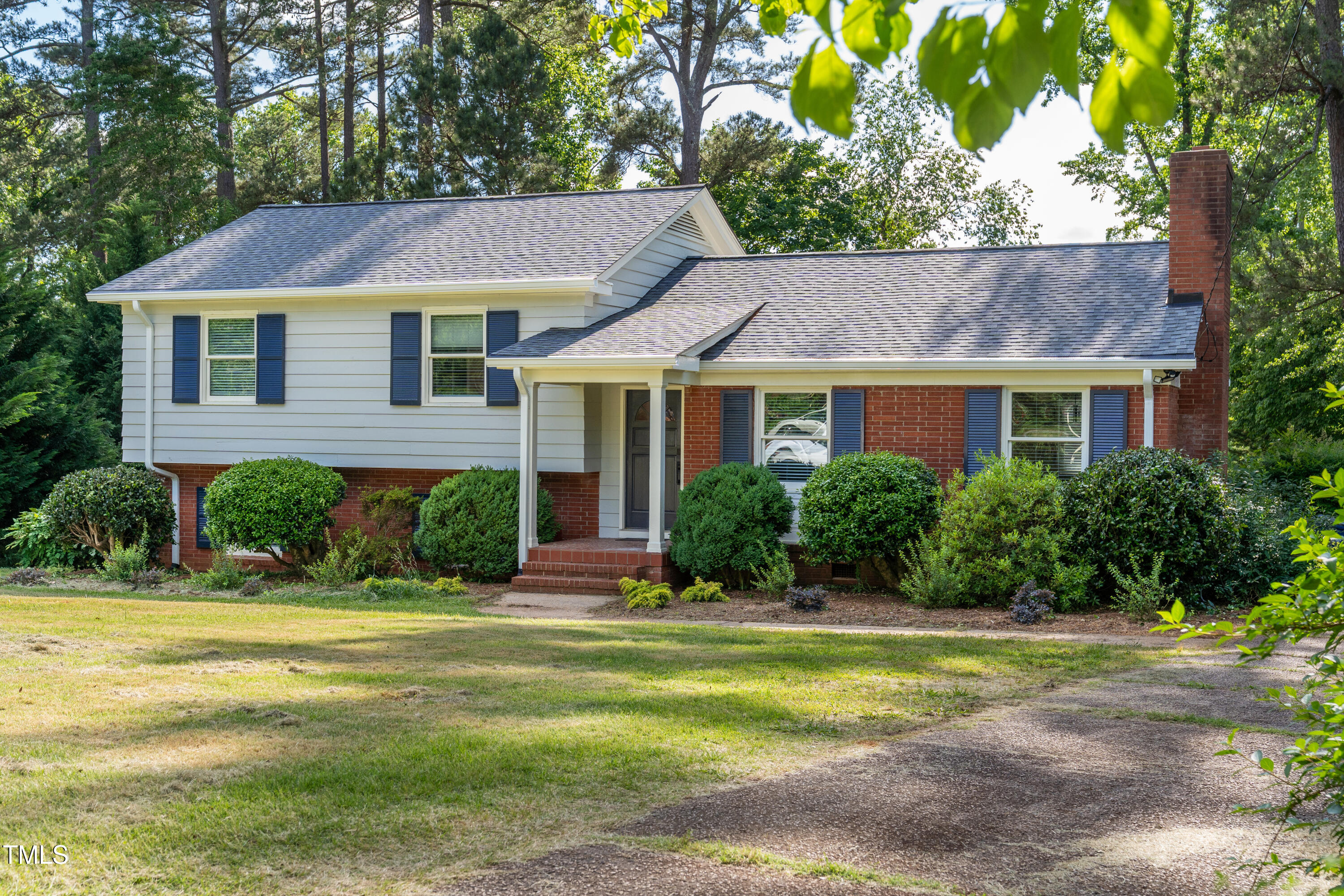 4813 Glen Forest Drive Raleigh, NC 27612 - Photo 2 of 39 a aerial view of a house next to a yard with plants and trees