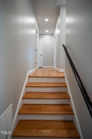a bathroom with a sink a toilet a window and a shower