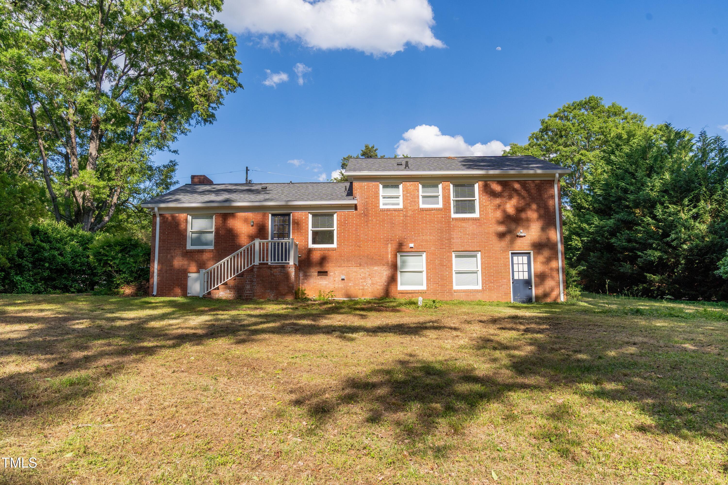 4813 Glen Forest Drive Raleigh, NC 27612 - Photo 37 of 39 a view of a house with a yard