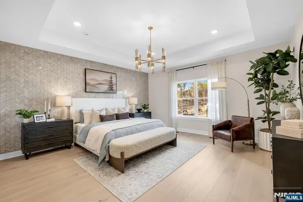 a bedroom with a bed and a chair