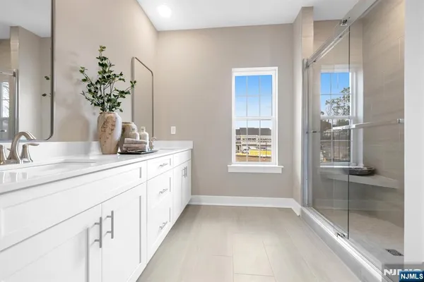 a bathroom with a sink a vanity and a mirror