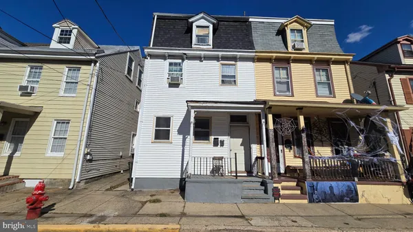 a front view of a house with glass windows