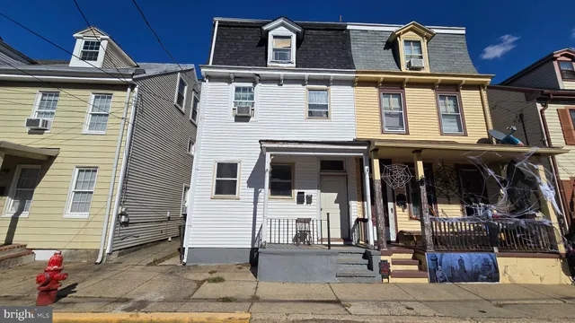 a front view of a house with glass windows
