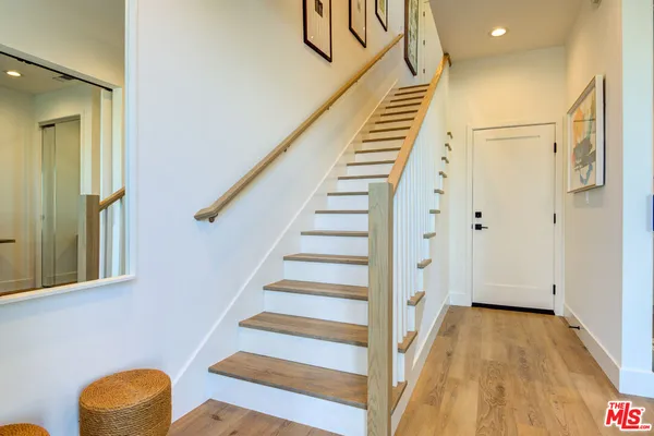 a view of entryway with wooden floor