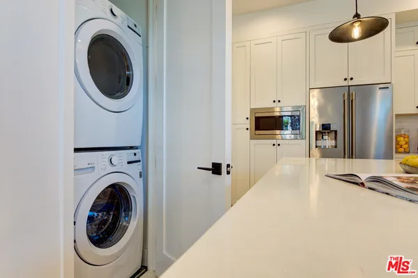 a view of a kitchen with washer and dryer