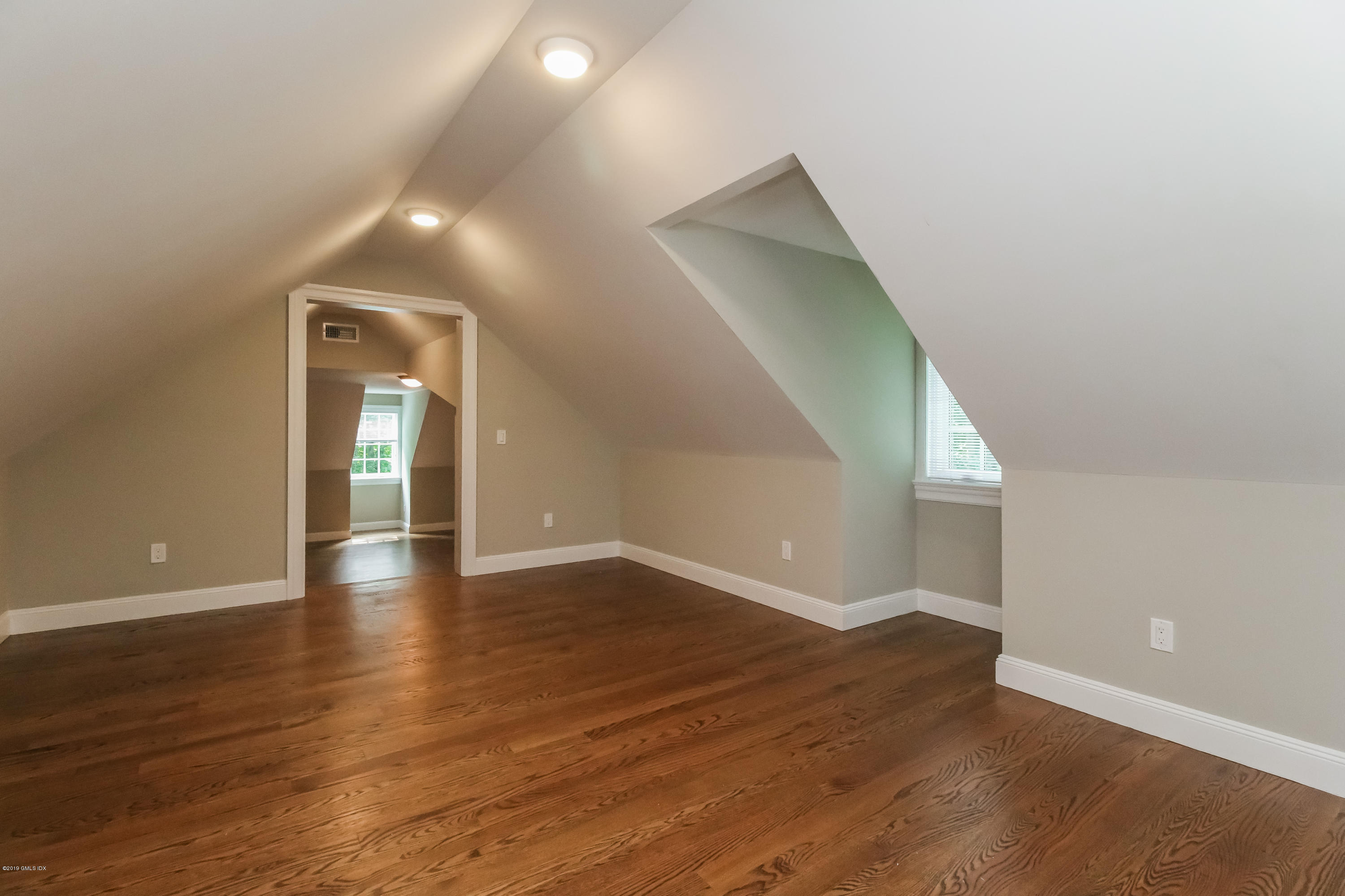54 Dandy Drive Cos Cob, CT 06807 - Photo 28 of 35 a view of a hallway with wooden floor
