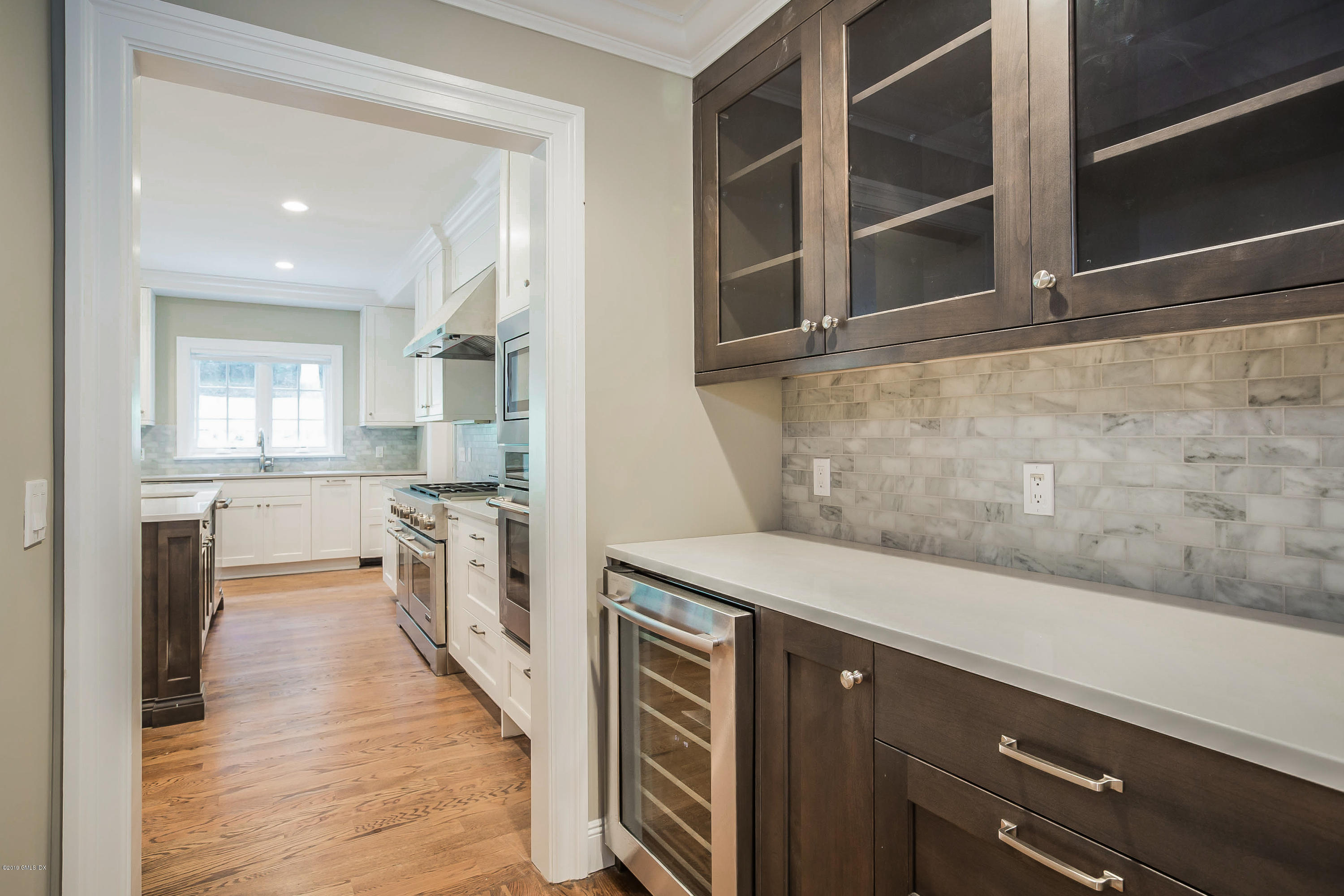 54 Dandy Drive Cos Cob, CT 06807 - Photo 5 of 35 a kitchen with stainless steel appliances a refrigerator and a stove top oven