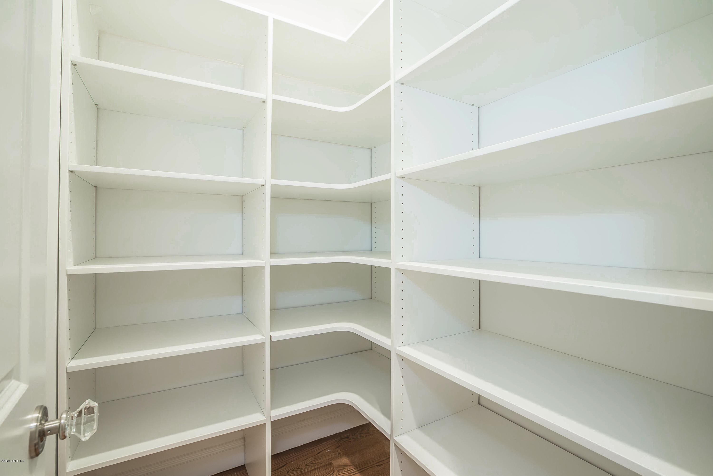 54 Dandy Drive Cos Cob, CT 06807 - Photo 6 of 35 a view of walk in closet with empty racks