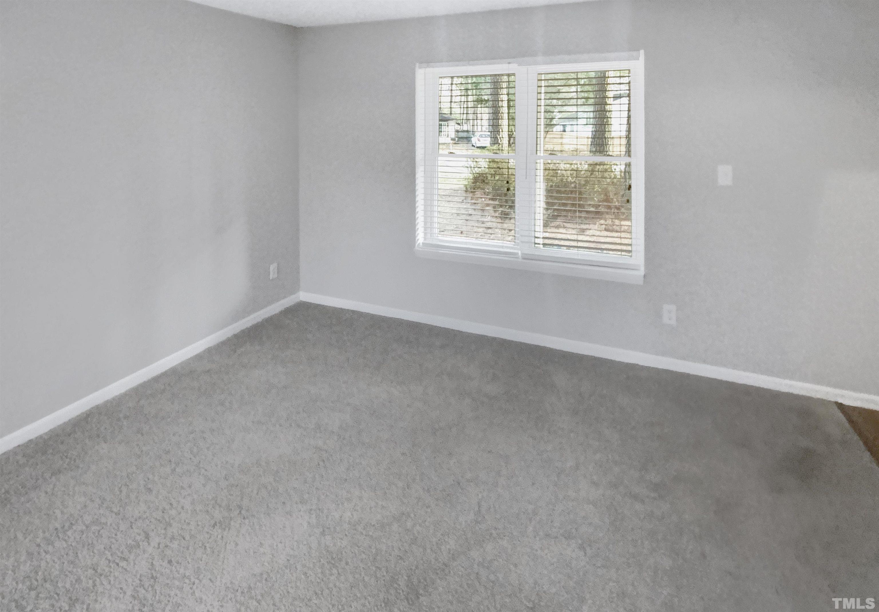 2404 Tusket Court Raleigh, NC 27613 - Photo 12 of 19 an empty room with a window