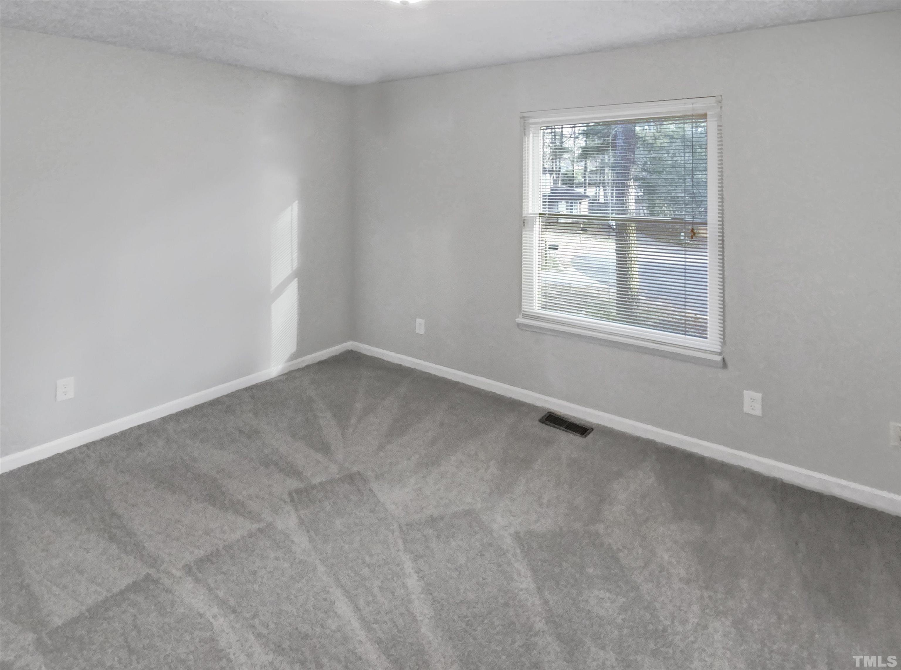2404 Tusket Court Raleigh, NC 27613 - Photo 13 of 19 an empty room with a window