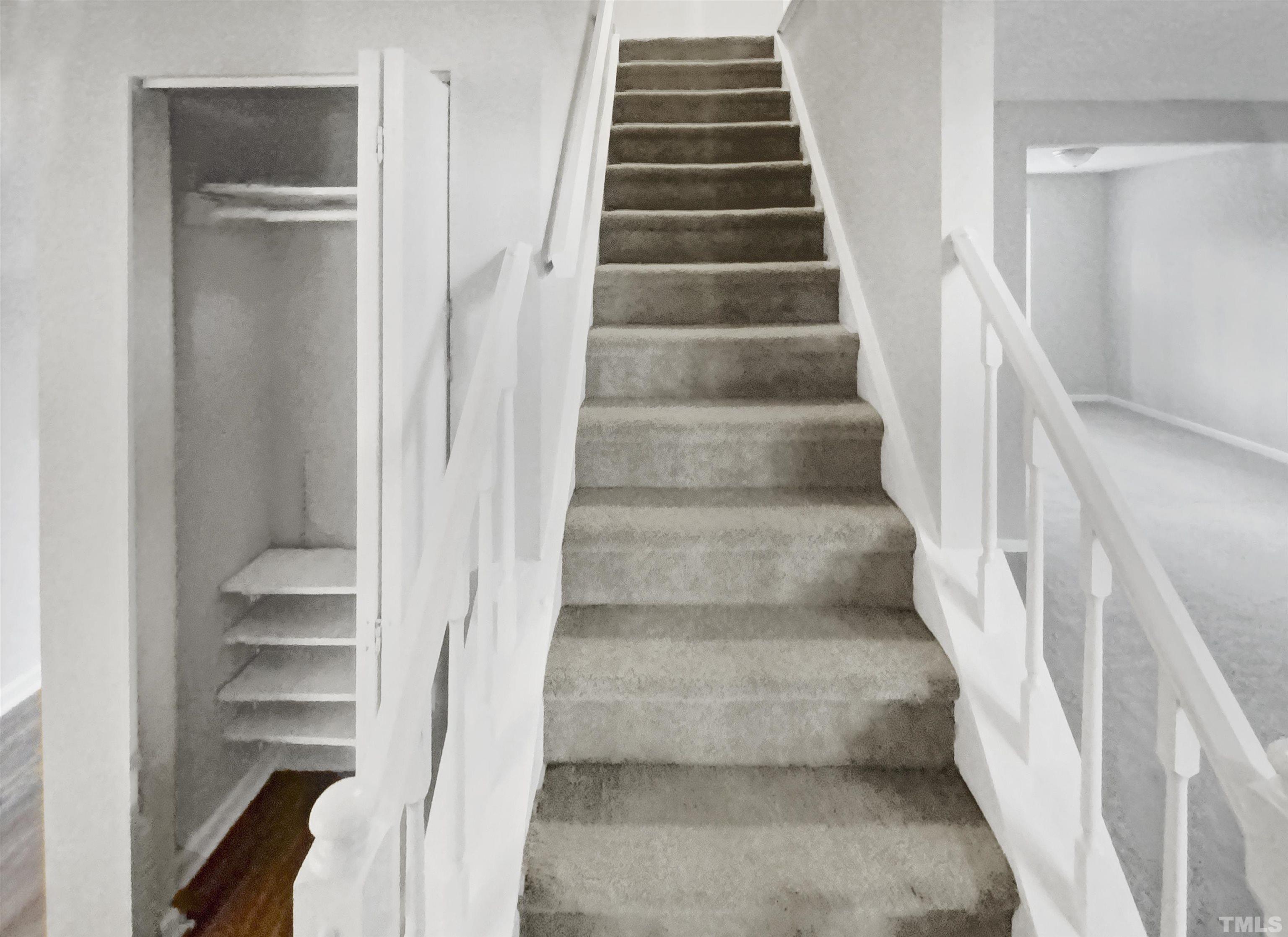 2404 Tusket Court Raleigh, NC 27613 - Photo 14 of 19 a view of staircase with white walls