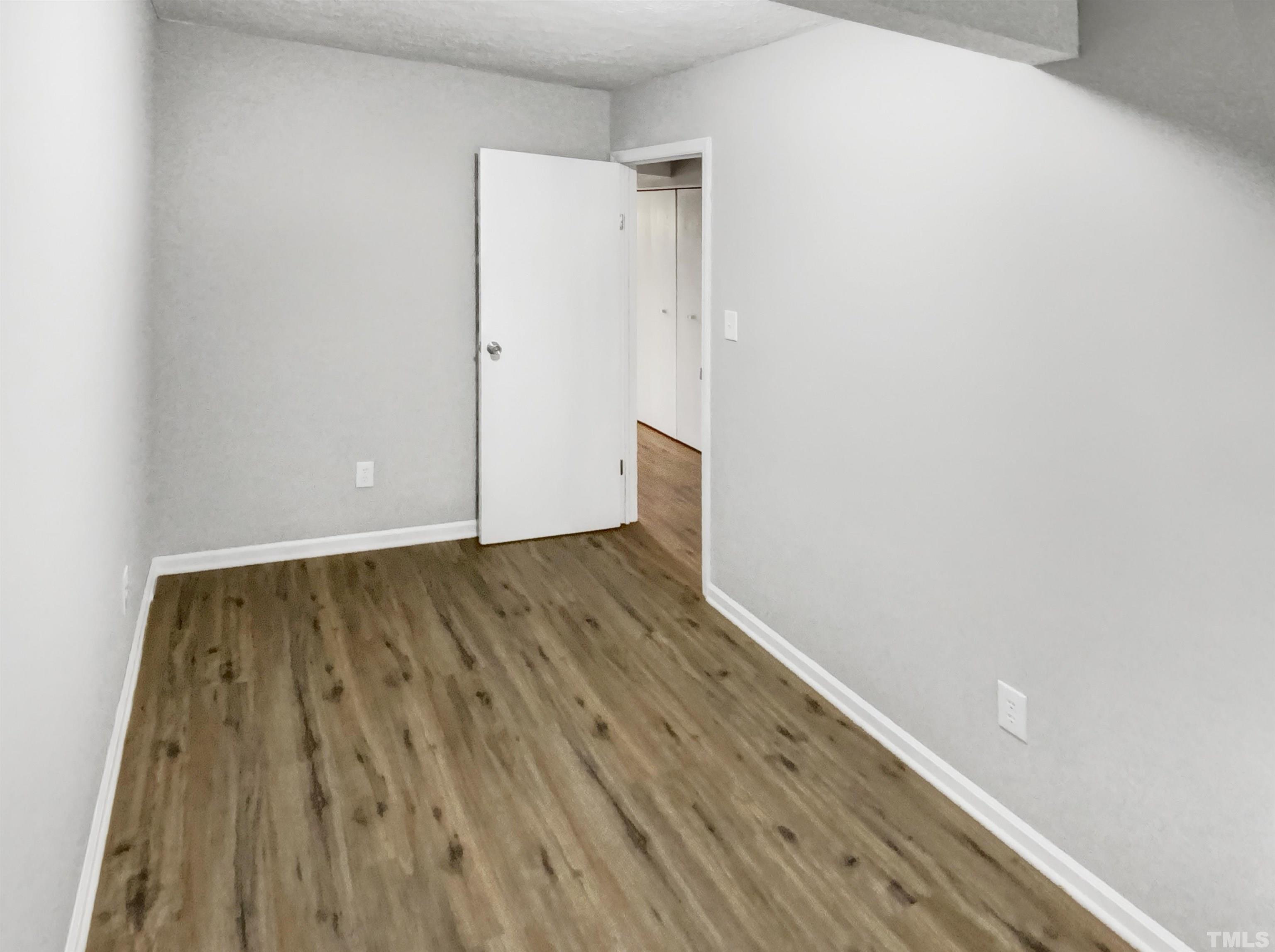 2404 Tusket Court Raleigh, NC 27613 - Photo 16 of 19 a view of wooden floor