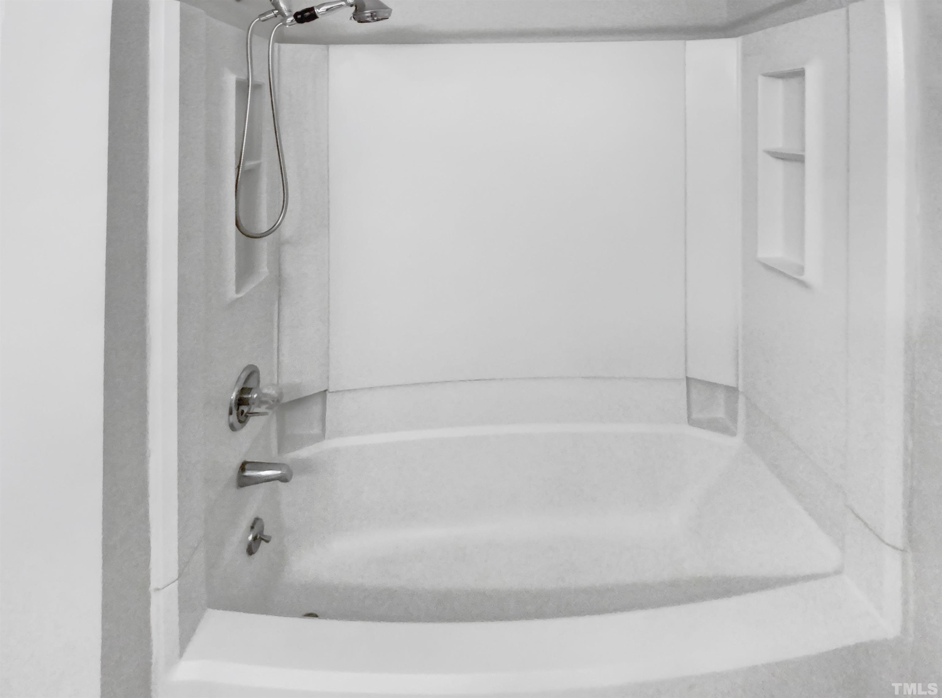 2404 Tusket Court Raleigh, NC 27613 - Photo 8 of 19 a close view of a bathtub in bathroom