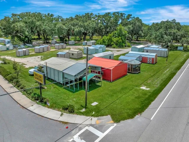 a view of a street with a car parked in the background