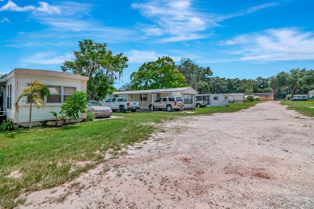 13285 Highway 92 Dover, FL 33527 - Photo 50 of 76 a view of a backyard with plants and palm trees