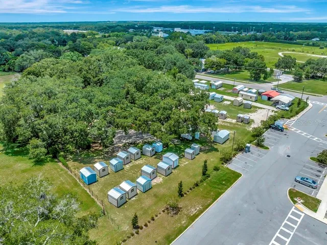 an aerial view of residential houses with outdoor space