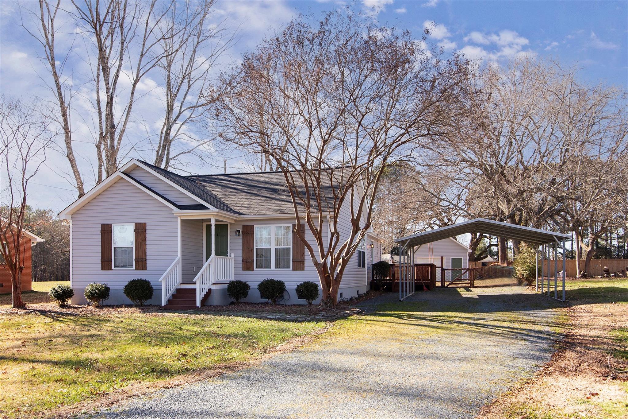 210 Church Street Locust, NC 28097 - Photo 1 of 22 a view of a house with snow and covered with yard