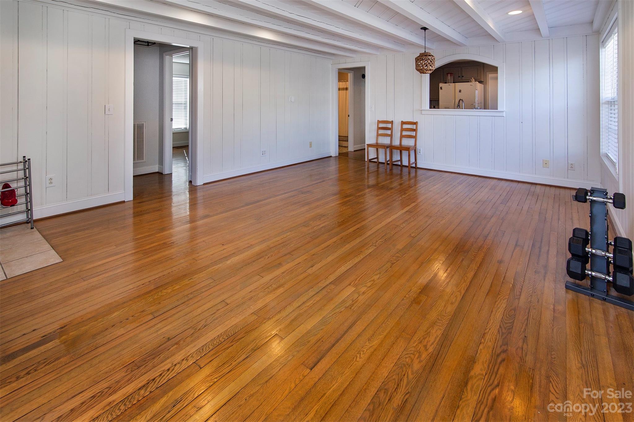 210 Church Street Locust, NC 28097 - Photo 11 of 22 a view of empty room with wooden floor and fan