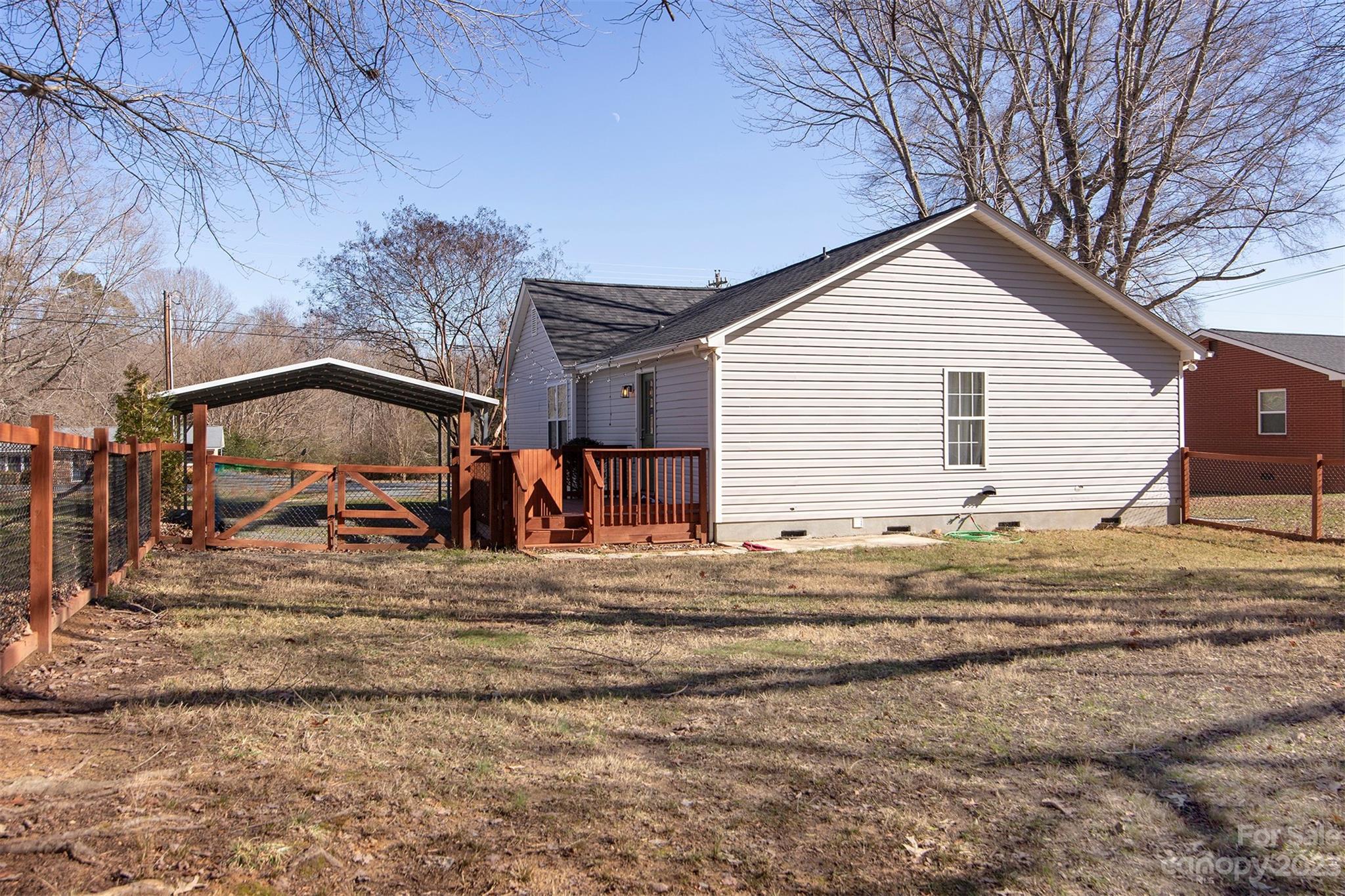 210 Church Street Locust, NC 28097 - Photo 19 of 22 a view of a house with a yard