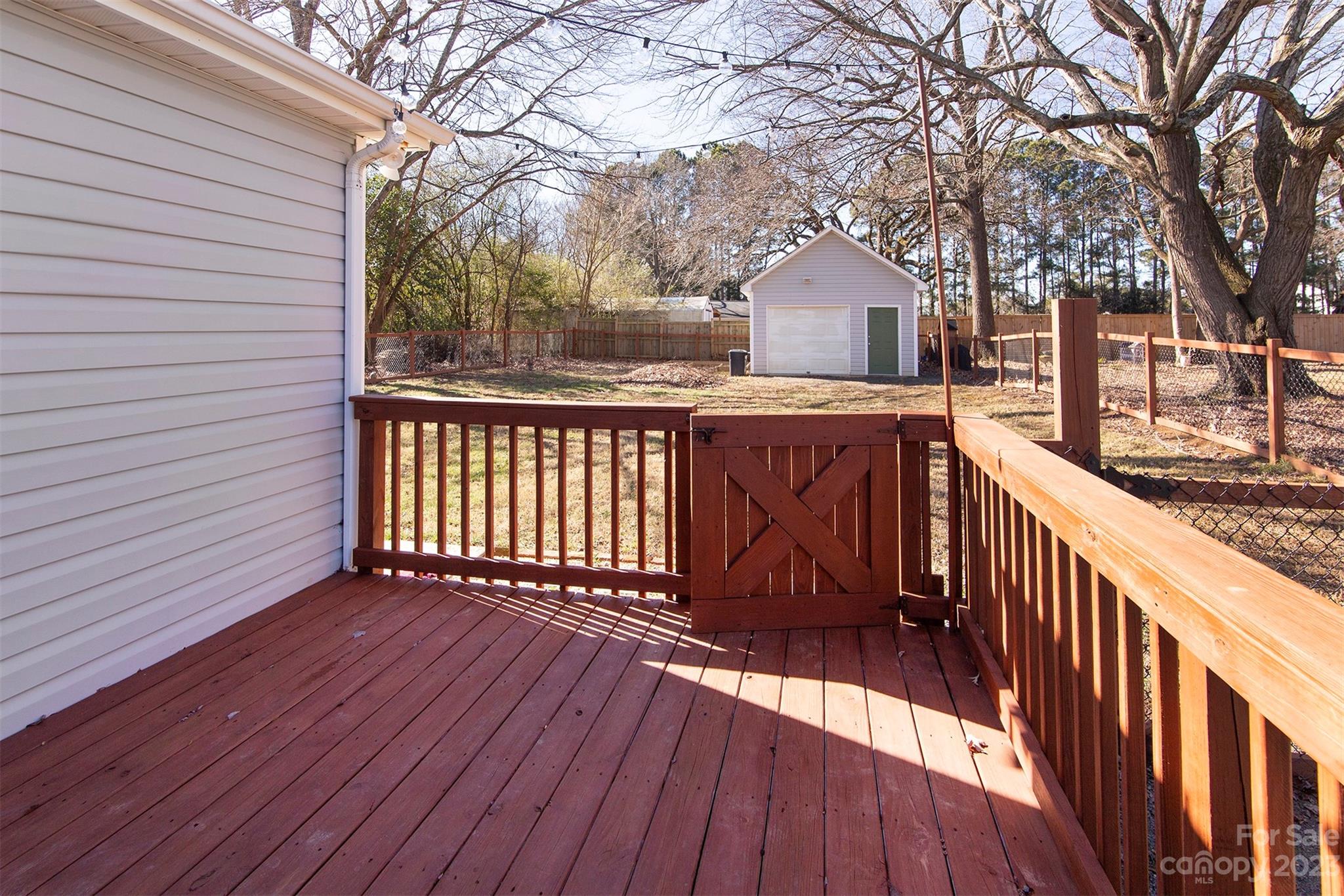 210 Church Street Locust, NC 28097 - Photo 20 of 22 a view of a house with wooden deck