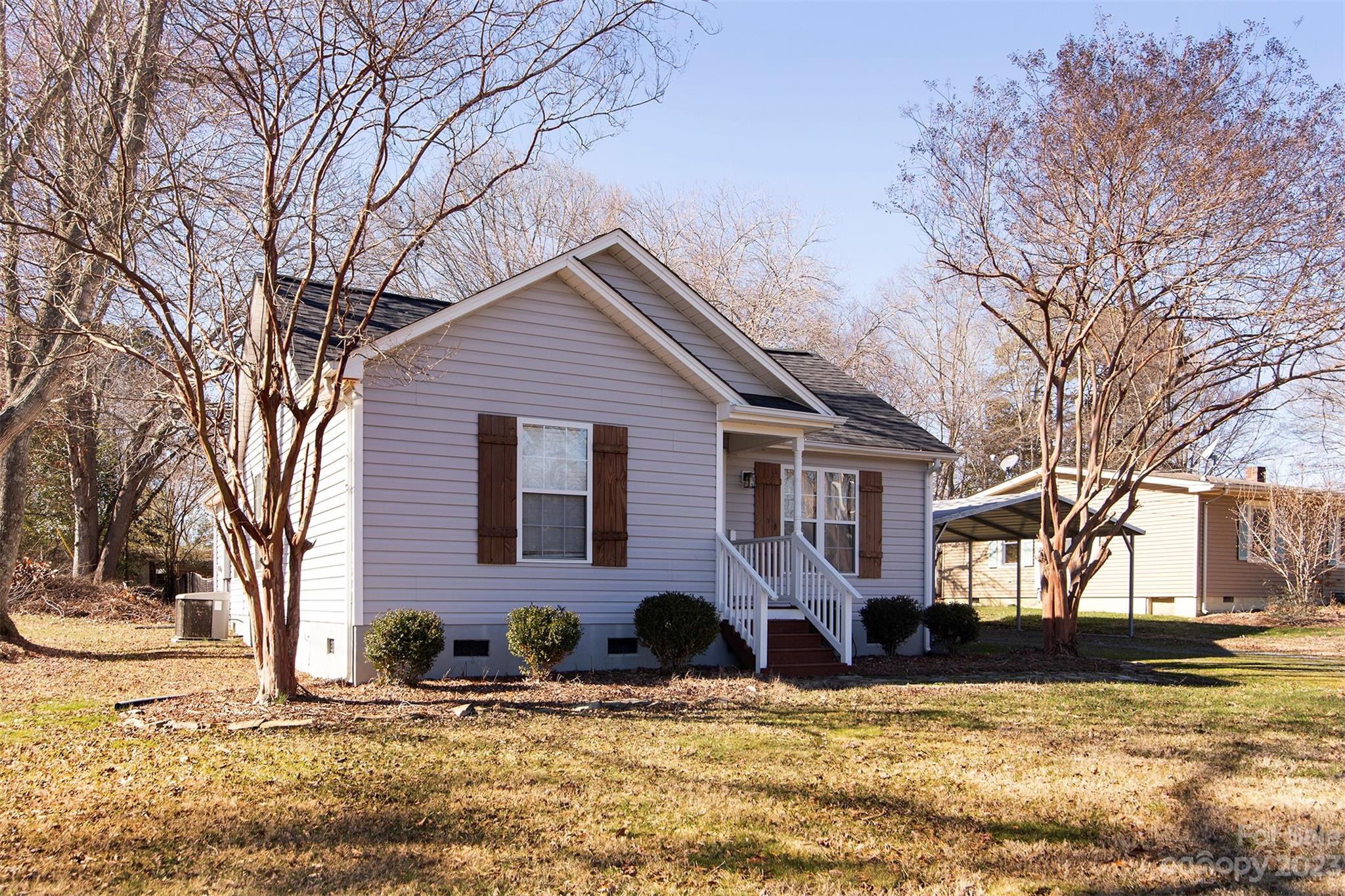 210 Church Street Locust, NC 28097 - Photo 4 of 22 a view of a house with snow on the tree