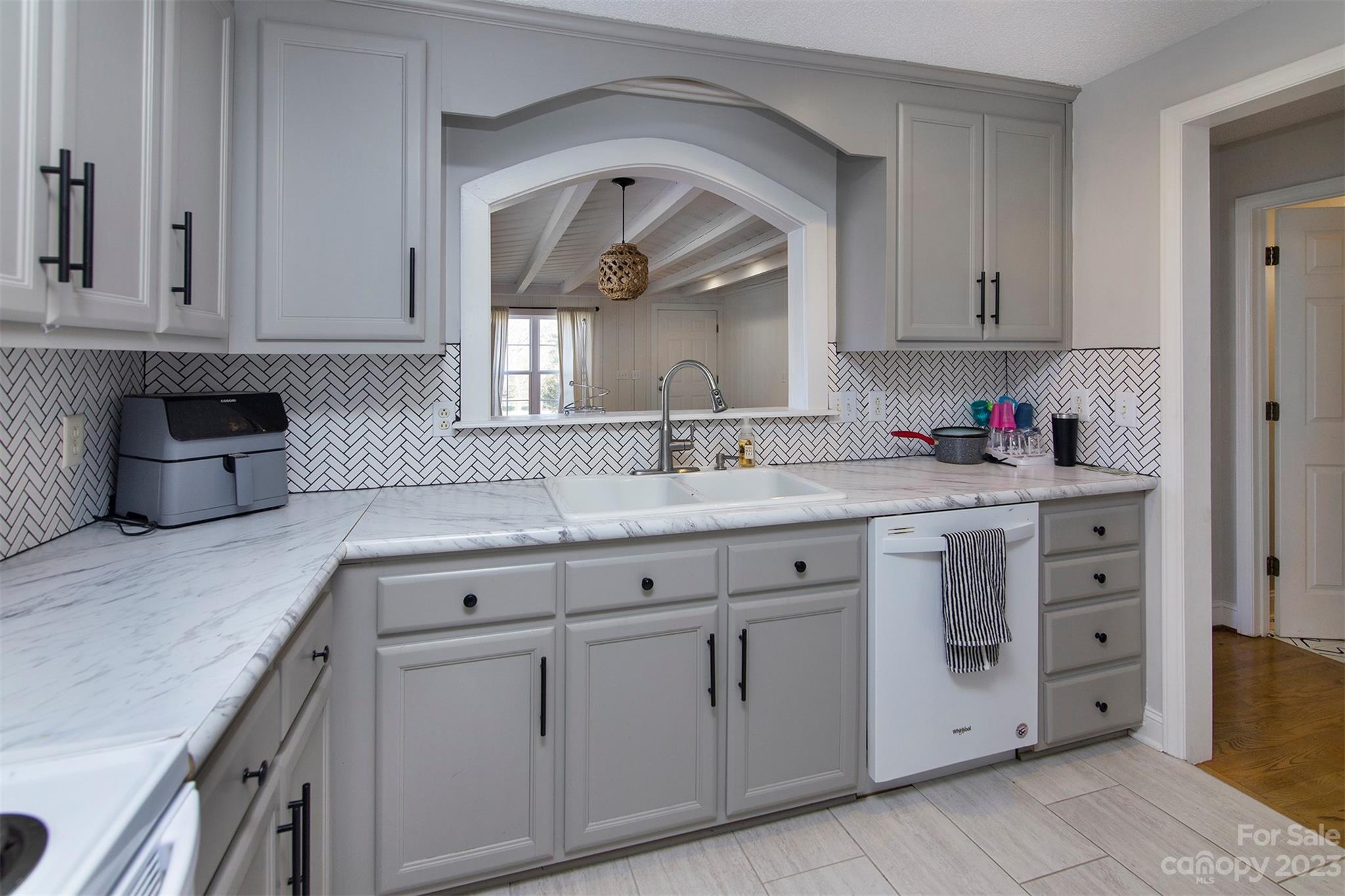 210 Church Street Locust, NC 28097 - Photo 5 of 22 a kitchen with white cabinets and sink