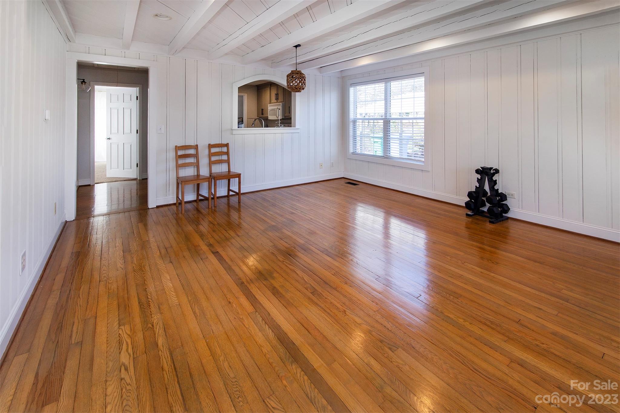 210 Church Street Locust, NC 28097 - Photo 10 of 22 wooden floor in an empty room with a window