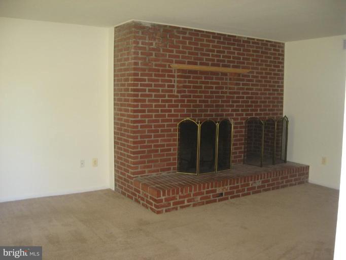 4902 Sweet Air Road Baldwin, MD 21013 - Photo 11 of 18 family room wood burning FP and brick hearth