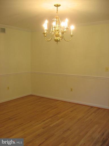 4902 Sweet Air Road Baldwin, MD 21013 - Photo 7 of 18 Crown & chair rail moldings & hardwood flooring