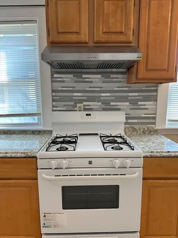 a kitchen with a refrigerator and a sink