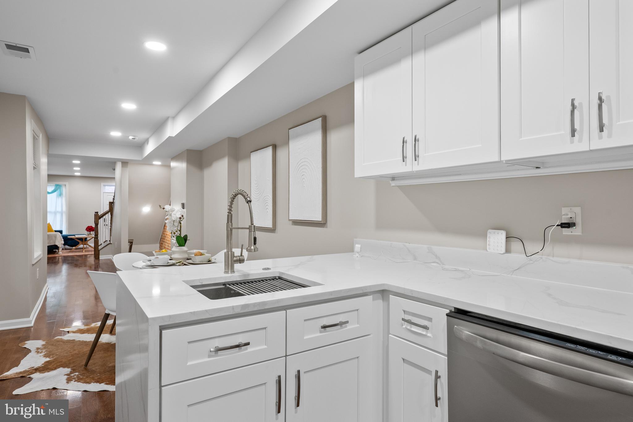 1358 Towson Street Baltimore, MD 21230 - Photo 12 of 39 a kitchen with kitchen island a sink and cabinets