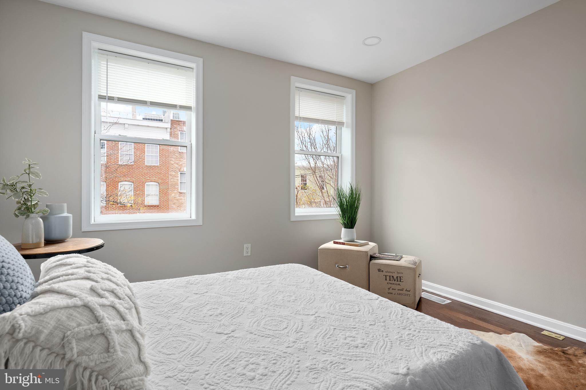 1358 Towson Street Baltimore, MD 21230 - Photo 17 of 39 a bedroom with a bed and wooden floor