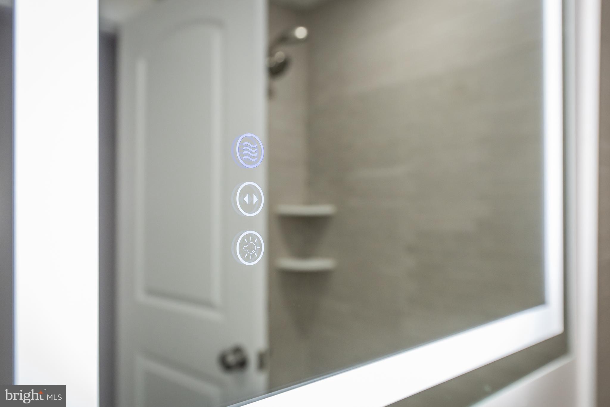 1358 Towson Street Baltimore, MD 21230 - Photo 31 of 39 a bathroom with a glass shower door