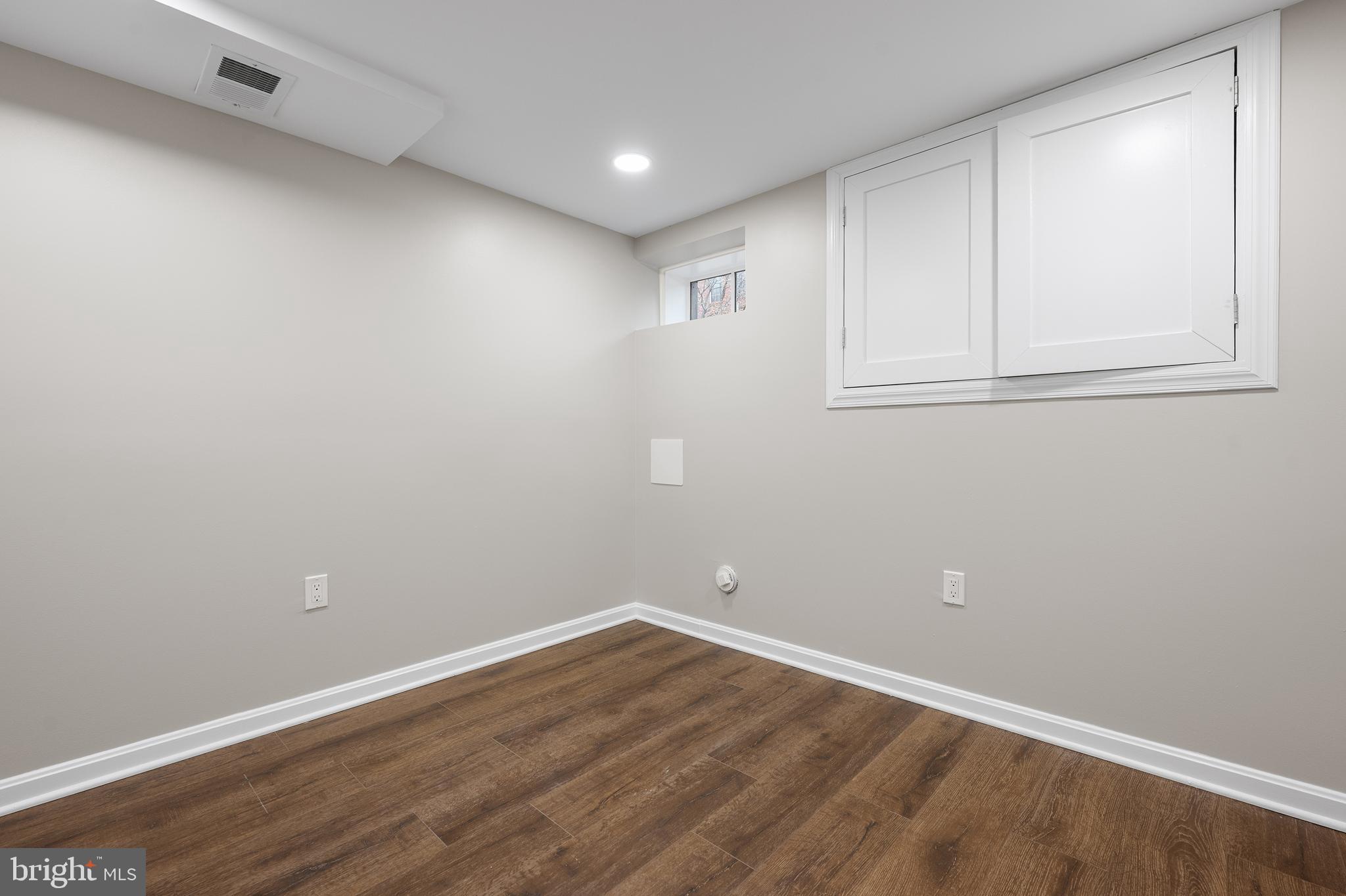 1358 Towson Street Baltimore, MD 21230 - Photo 34 of 39 a view of empty room with wooden floor