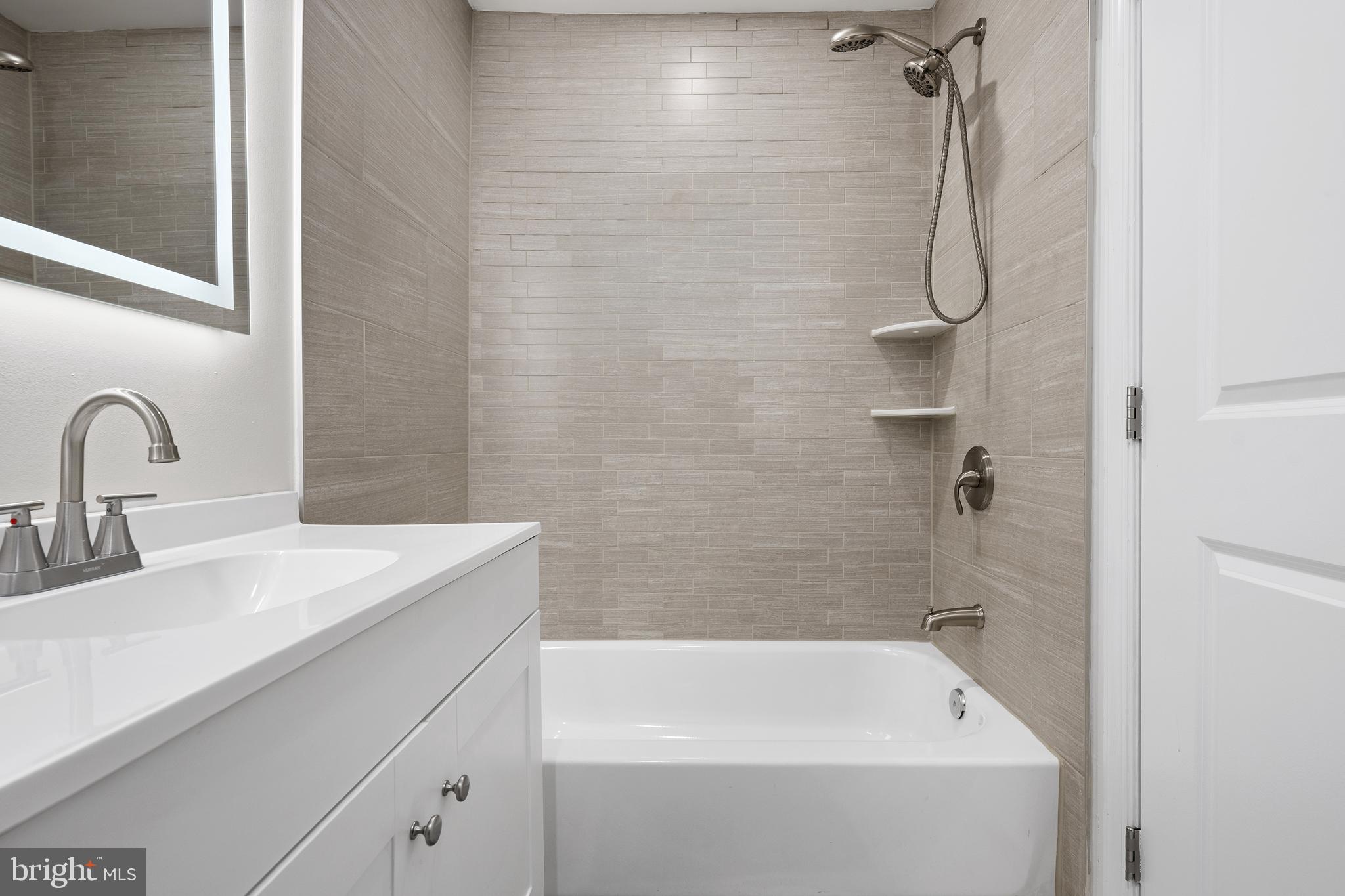 1358 Towson Street Baltimore, MD 21230 - Photo 36 of 39 a bathroom with a sink and a bathtub
