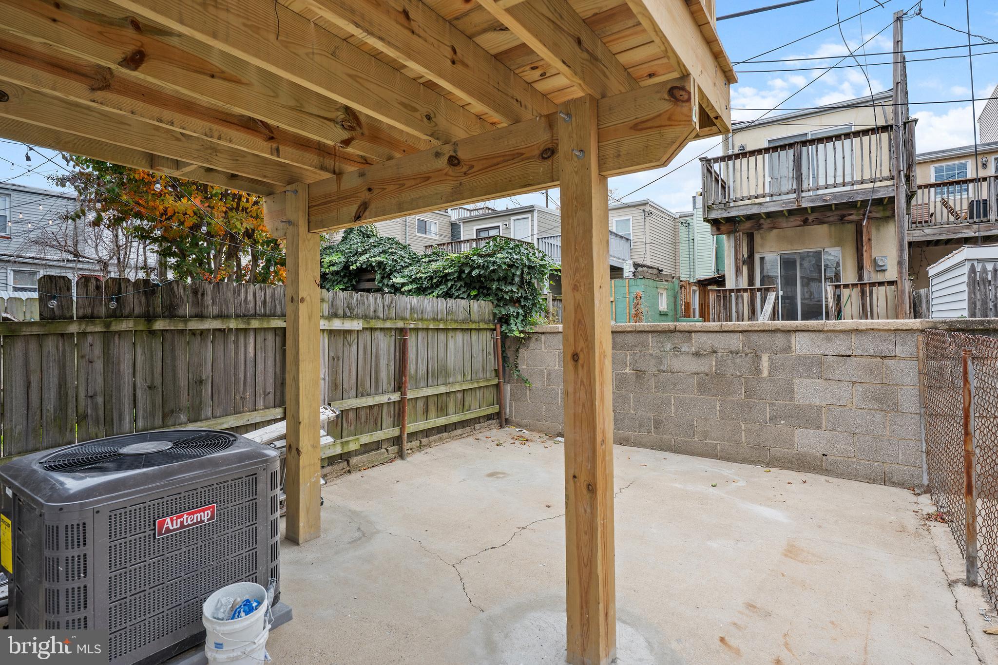 1358 Towson Street Baltimore, MD 21230 - Photo 38 of 39 a view of a patio with table and chairs